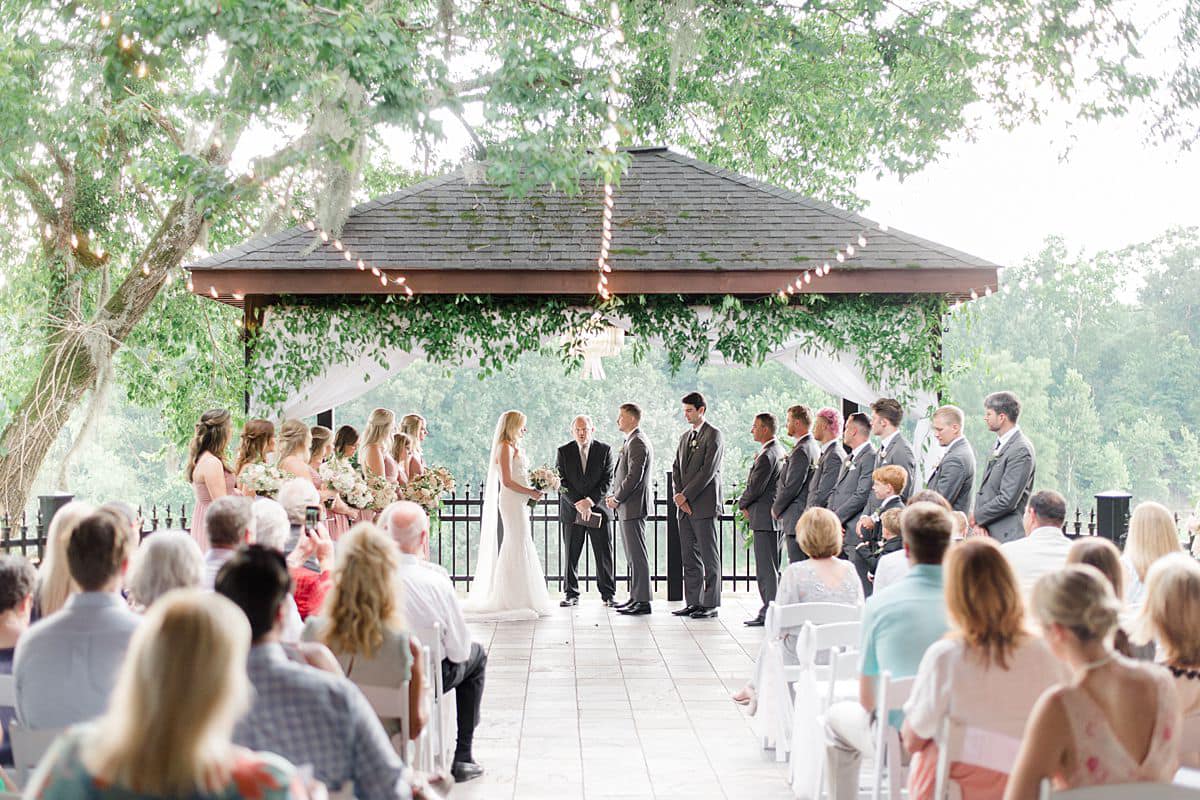 A wedding ceremony in front of an audience.